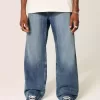 Blugi bootcut largi cu spalare medie Blugi bootcut largi cu spalare medie