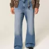 Blugi bootcut largi cu spalare medie Blugi bootcut largi cu spalare medie