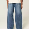 Blugi bootcut largi cu spalare medie Blugi bootcut largi cu spalare medie