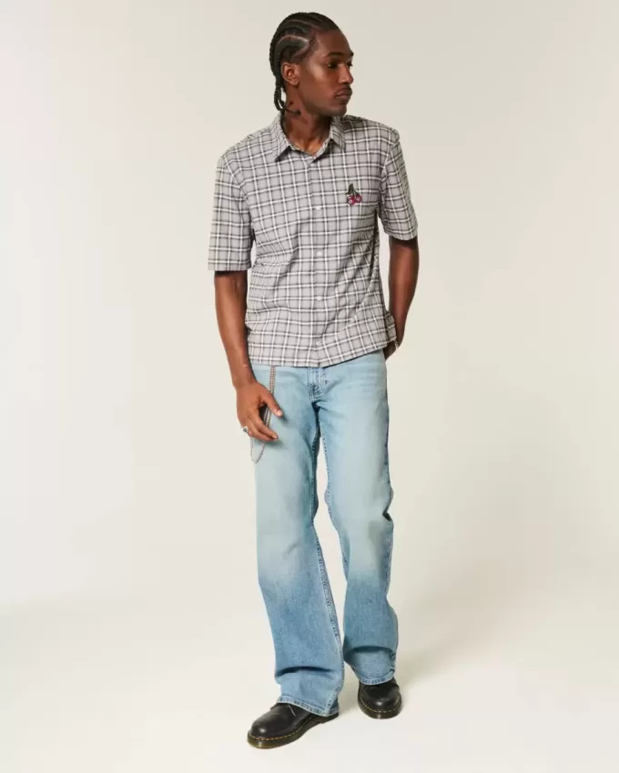 Blugi bootcut relaxați cu spălare medie Blugi bootcut relaxați cu spălare medie