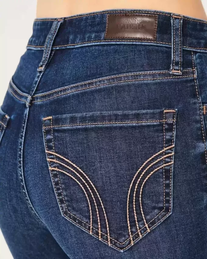 Blugi evazați cu talie înaltă, rupti, spalat la culoare închisă Blugi evazați cu talie înaltă, rupti, spalat la culoare închisă