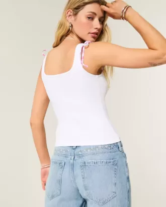Blugi largi, cu talie joasă, cu spălare medie, cu broderie florală