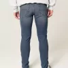 Blugi skinny atletici cu spalare medie Blugi skinny atletici cu spalare medie