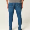 Blugi skinny atletici de culoare închisă Blugi skinny atletici de culoare închisă