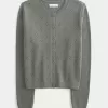 Cardigan cu ochiuri Cardigan cu ochiuri