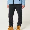 Pantaloni de jogging relaxați din lână alpină cu grafică Pantaloni de jogging relaxați din lână alpină cu grafică