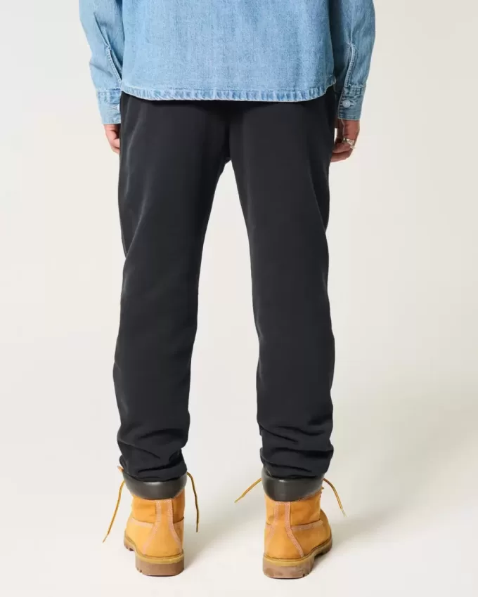Pantaloni de jogging relaxați din lână alpină cu grafică Pantaloni de jogging relaxați din lână alpină cu grafică