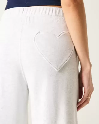 Pantaloni de sport cu picioare largi cu buzunar inimă
