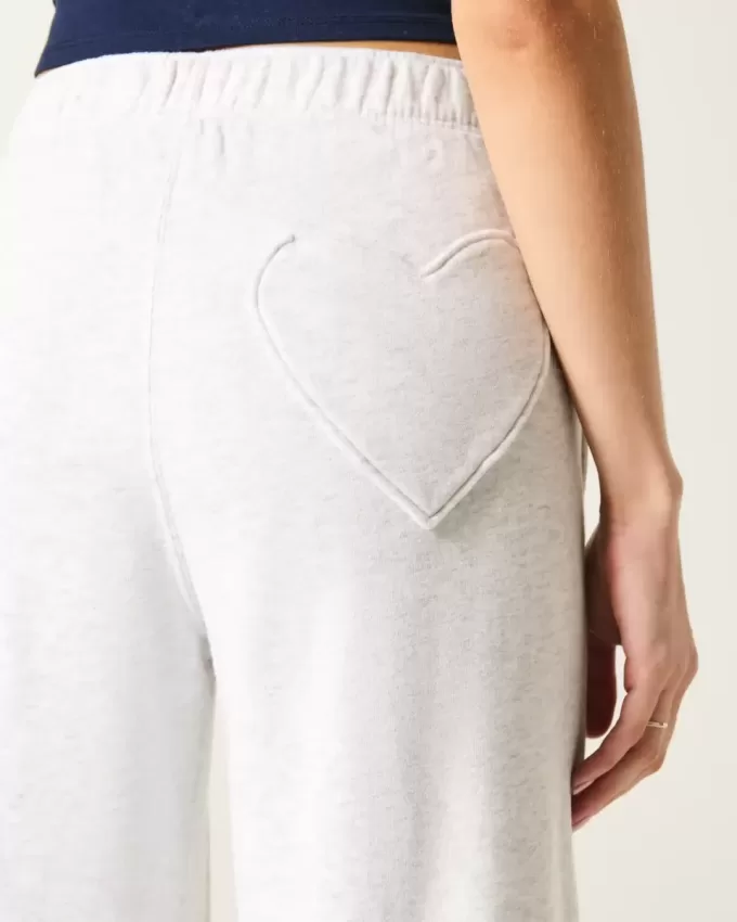 Pantaloni de sport cu picioare largi cu buzunar inimă Pantaloni de sport cu picioare largi cu buzunar inimă