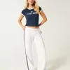 Pantaloni de sport cu picioare largi în dungi Pantaloni de sport cu picioare largi în dungi