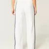 Pantaloni de sport cu picioare largi în dungi Pantaloni de sport cu picioare largi în dungi