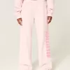 Pantaloni de sport cu sigla cu picioare largi Pantaloni de sport cu sigla cu picioare largi