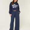 Pantaloni de sport largi cu funda grafică Pantaloni de sport largi cu funda grafică