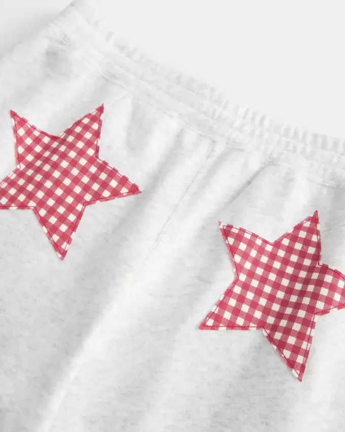 Pantaloni de sport largi cu grafic Star Pantaloni de sport largi cu grafic Star