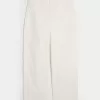Pantaloni largi de dulgher conici cu talie joasă Pantaloni largi de dulgher conici cu talie joasă