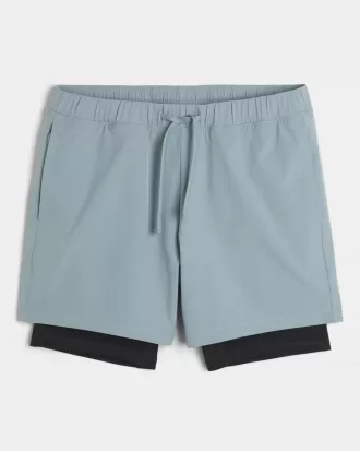 Pantaloni scurți activi hibridi la jumătatea coapsei Pantaloni scurți activi hibridi la jumătatea coapsei