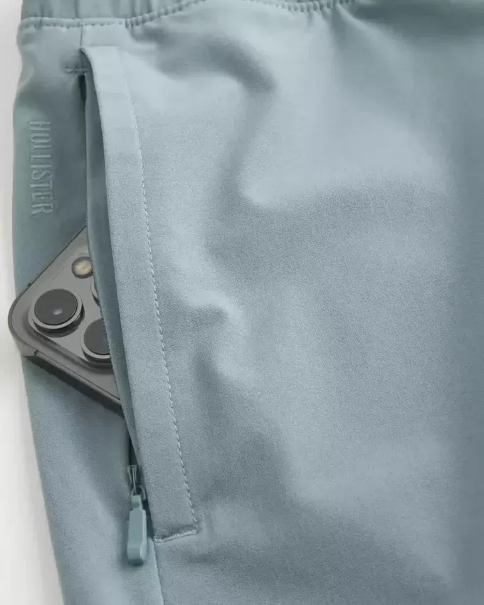 Pantaloni scurți activi hibridi la jumătatea coapsei Pantaloni scurți activi hibridi la jumătatea coapsei