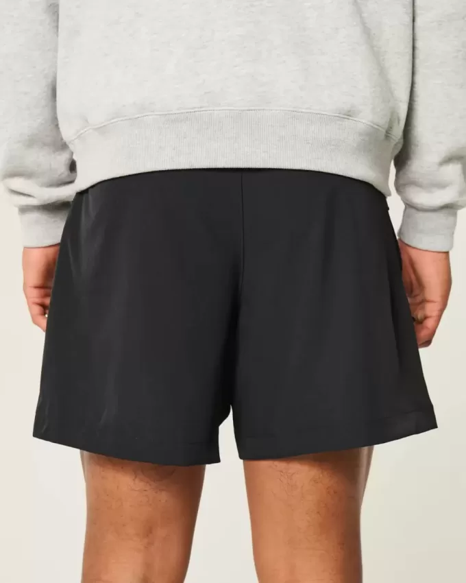 Pantaloni scurți activi hibridi la jumătatea coapsei Pantaloni scurți activi hibridi la jumătatea coapsei
