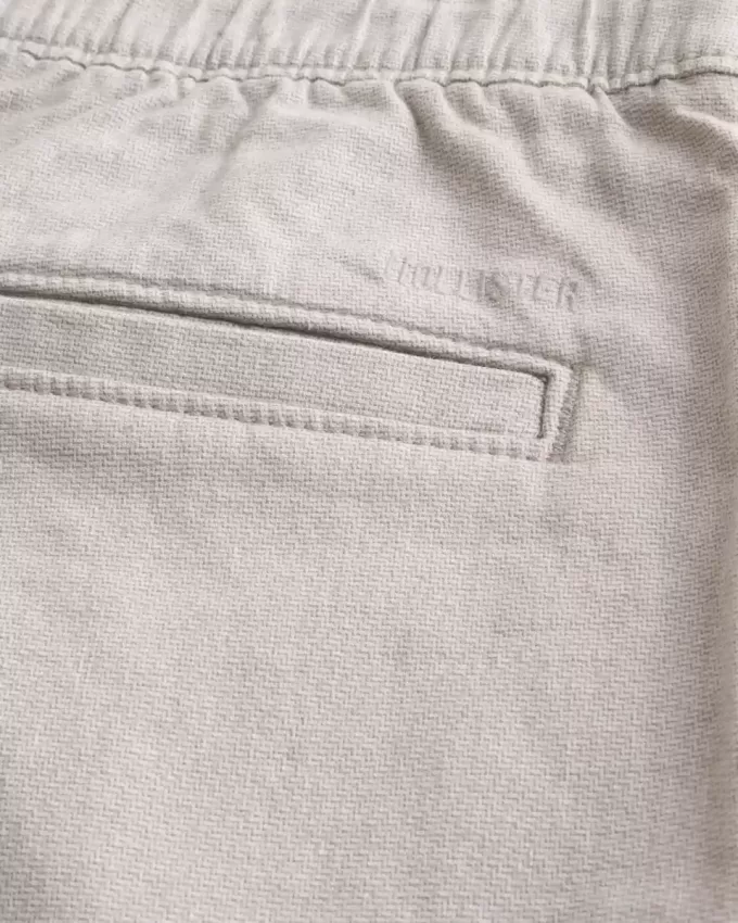 Pantaloni scurți cu fața plată din amestec de in până la genunchi