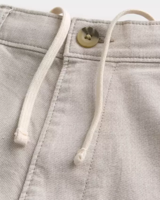 Pantaloni scurți cu fața plată din amestec de in până la genunchi