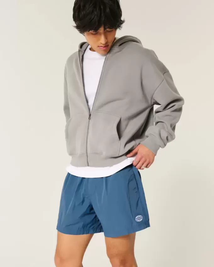Pantaloni scurți de fotbal largi la jumătatea coapsei Pantaloni scurți de fotbal largi la jumătatea coapsei