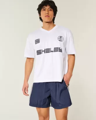 Pantaloni scurți de fotbal largi la jumătatea coapsei