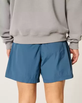 Pantaloni scurți de fotbal largi la jumătatea coapsei