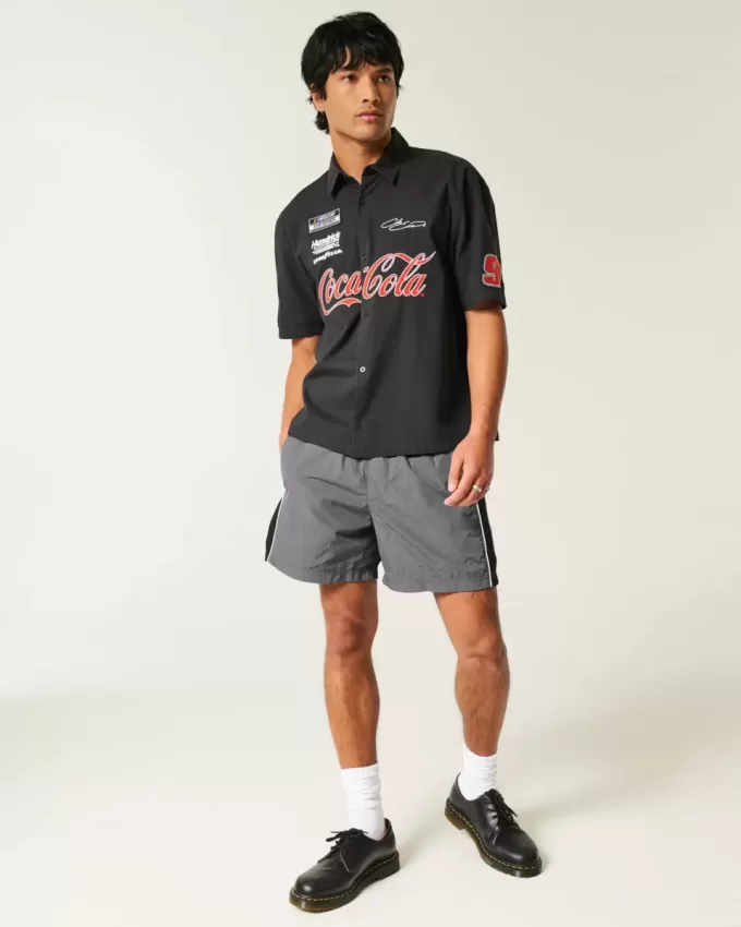 Pantaloni scurți de fotbal largi la jumătatea coapsei Pantaloni scurți de fotbal largi la jumătatea coapsei