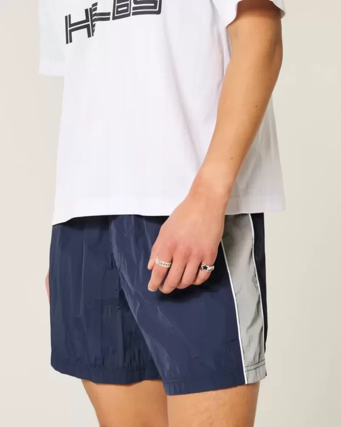 Pantaloni scurți de fotbal largi la jumătatea coapsei Pantaloni scurți de fotbal largi la jumătatea coapsei