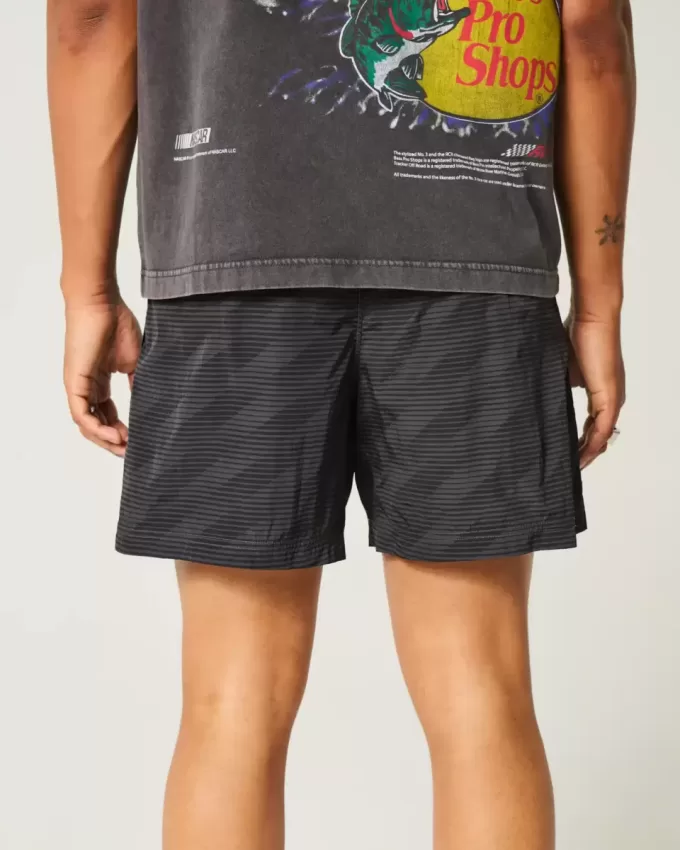 Pantaloni scurți de fotbal largi la jumătatea coapsei Pantaloni scurți de fotbal largi la jumătatea coapsei