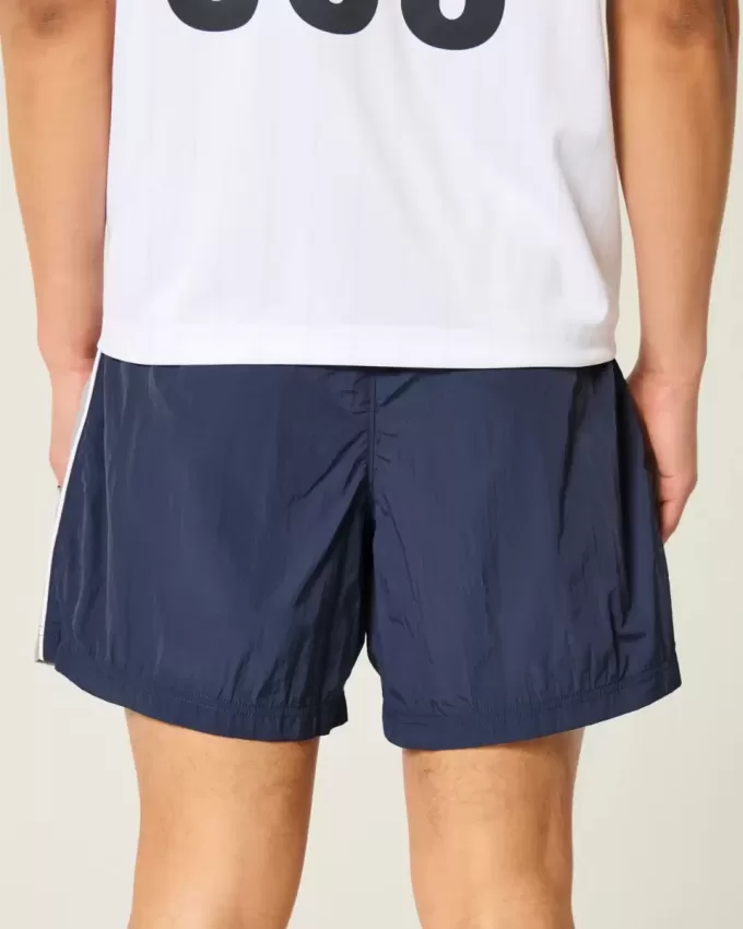 Pantaloni scurți de fotbal largi la jumătatea coapsei Pantaloni scurți de fotbal largi la jumătatea coapsei