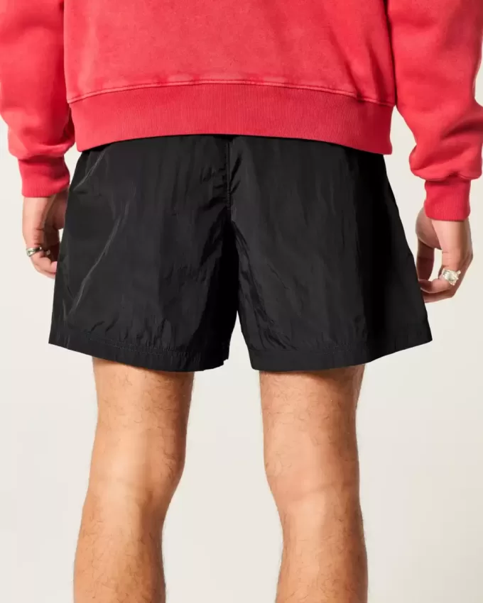 Pantaloni scurți de fotbal largi la jumătatea coapsei Pantaloni scurți de fotbal largi la jumătatea coapsei