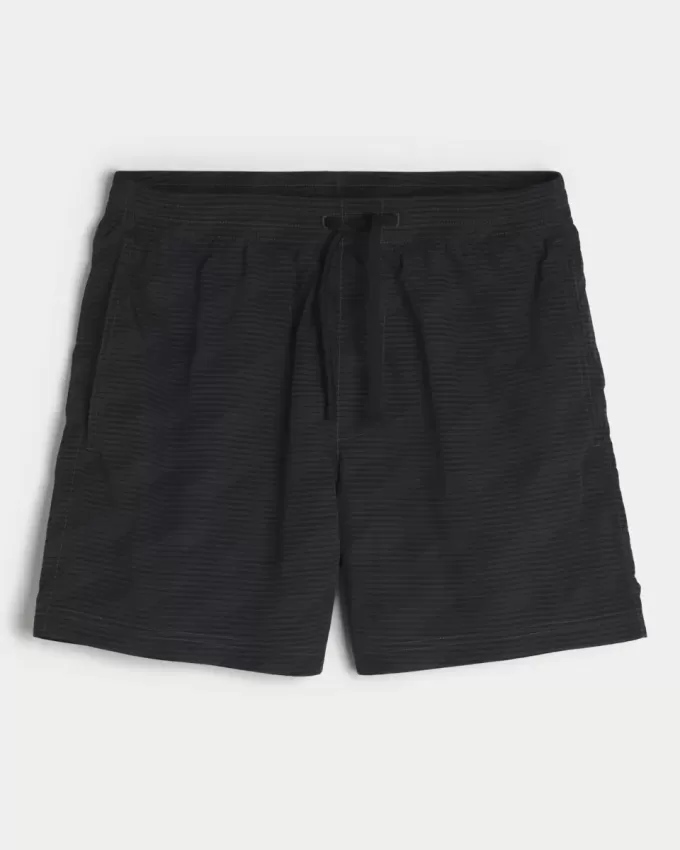 Pantaloni scurți de fotbal largi la jumătatea coapsei Pantaloni scurți de fotbal largi la jumătatea coapsei