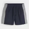 Pantaloni scurți de fotbal largi la jumătatea coapsei Pantaloni scurți de fotbal largi la jumătatea coapsei