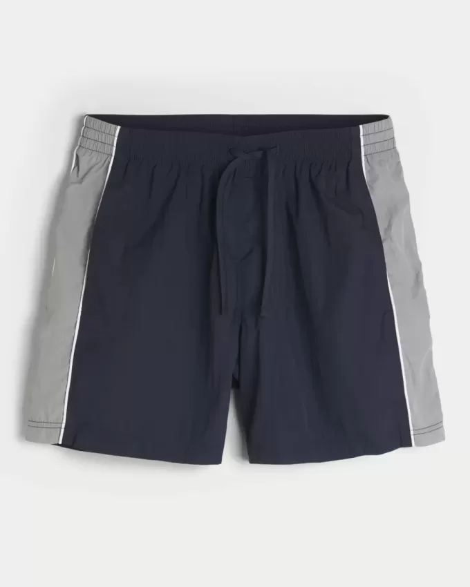 Pantaloni scurți de fotbal largi la jumătatea coapsei Pantaloni scurți de fotbal largi la jumătatea coapsei
