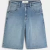 Pantaloni scurți din denim super baggy cu spălare medie Pantaloni scurți din denim super baggy cu spălare medie