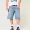 Pantaloni scurți din denim super largi, cu spălare medie sub genunchi