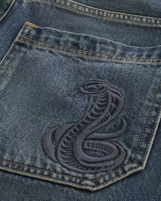 Pantaloni scurți largi din denim cu grafic șarpe