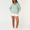 Pulover supradimensionat cu decolteu în V Hollister Comfy Cloud